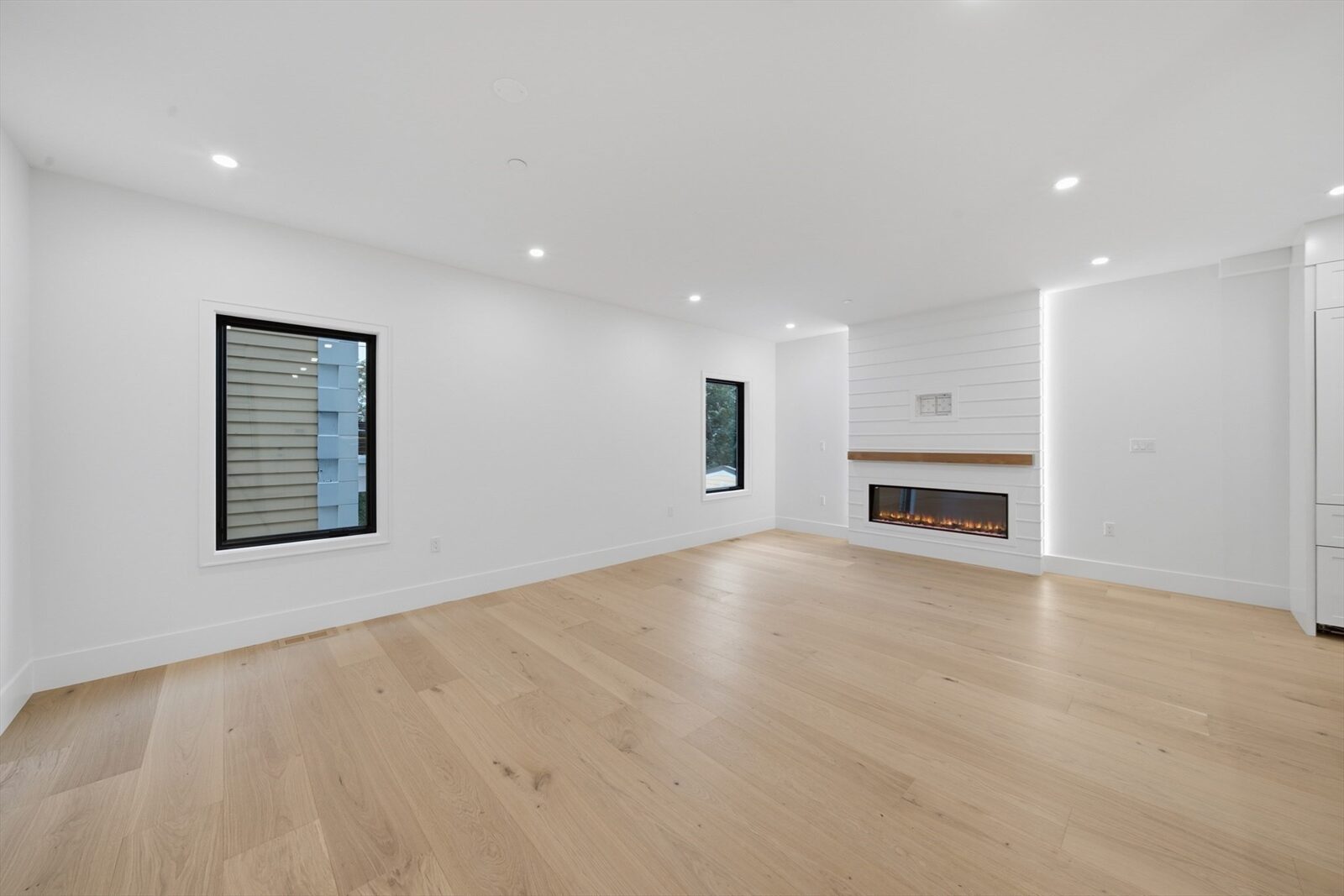 Living area with windows at 421 East Sixth Street, Residence 3