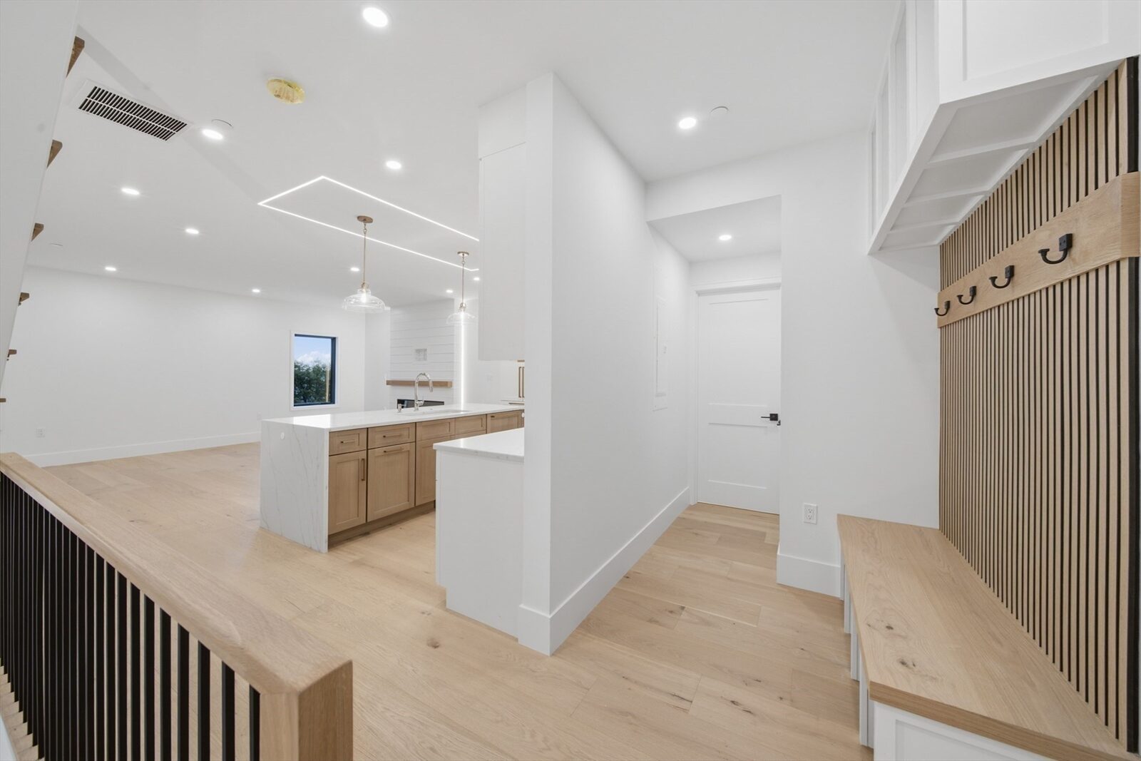 Kitchen looking toward the island at 421 East Sixth Street, Residence 3