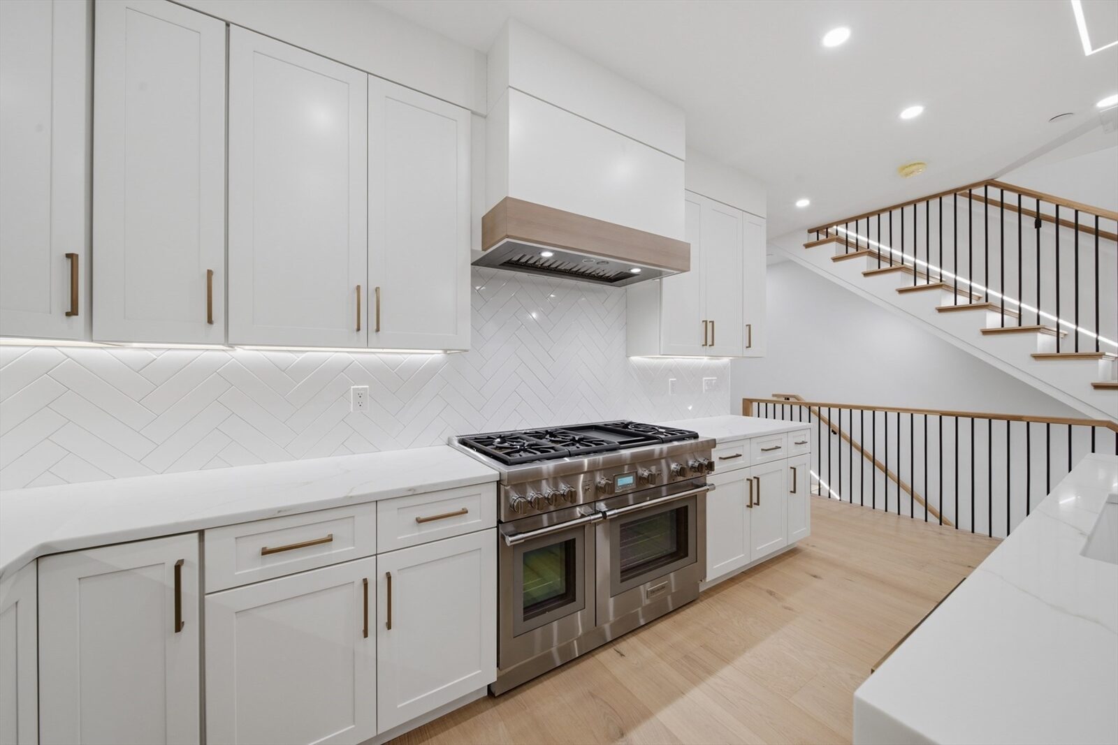 Kitchen range and cabinetry at 421 East Sixth Street, Residence 3