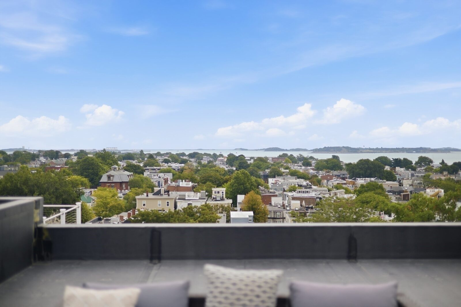 Roof deck seating looking toward the water at 421 East Sixth Street, Residence 3