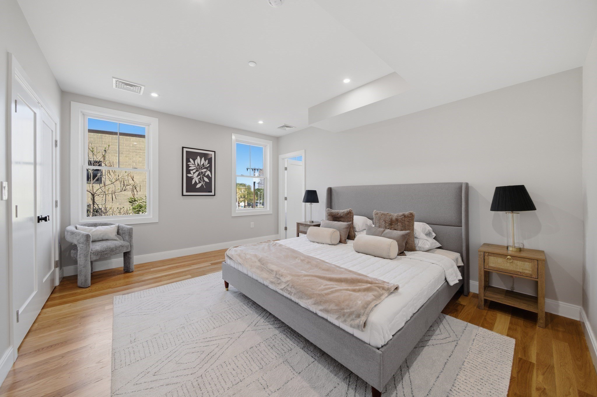Renovated kitchen at 174 Walnut Street Unit 2 with quartz waterfall island and stainless appliances