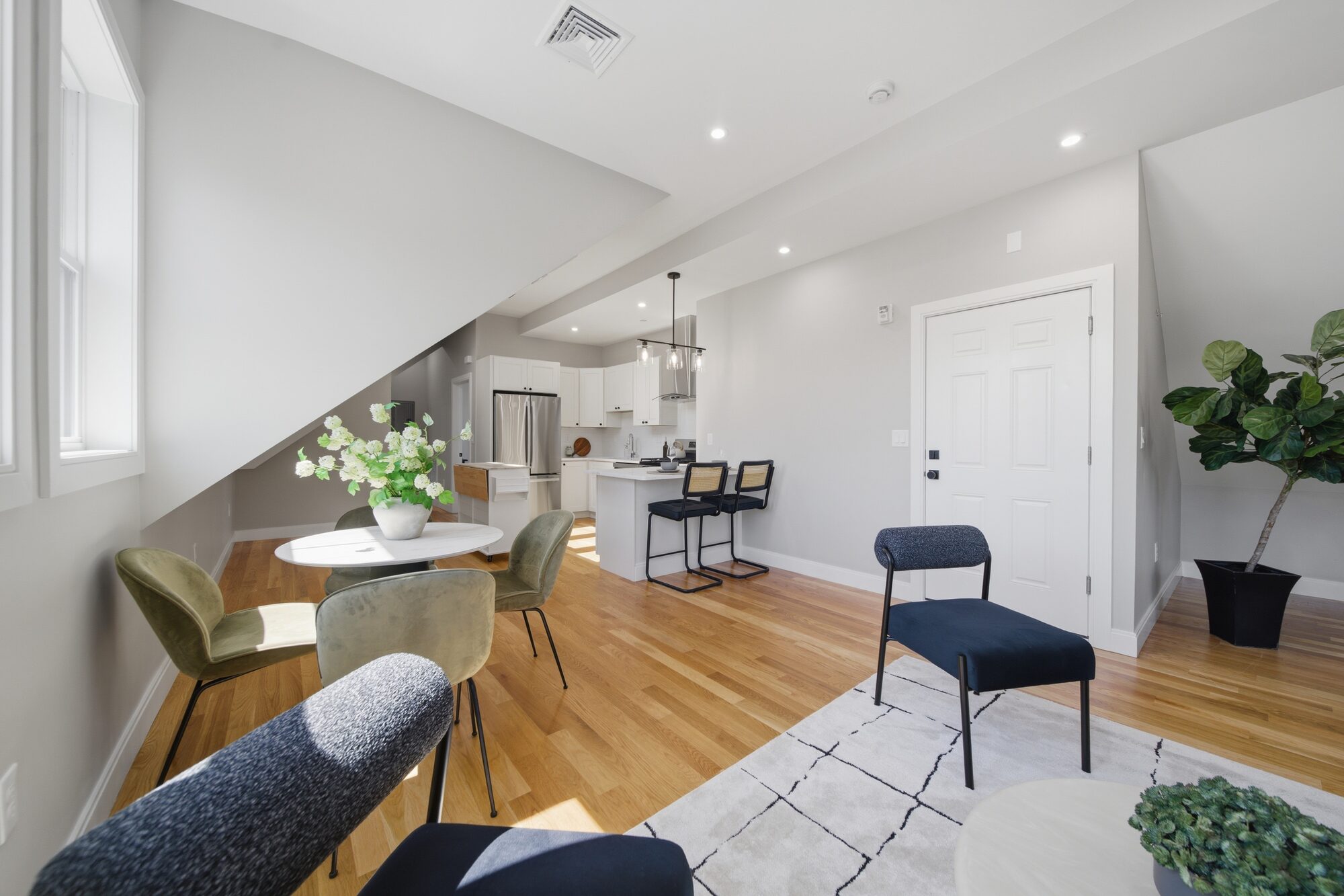 Living-dining looking toward the kitchen and unit entry at 174 Walnut Street, Unit 3