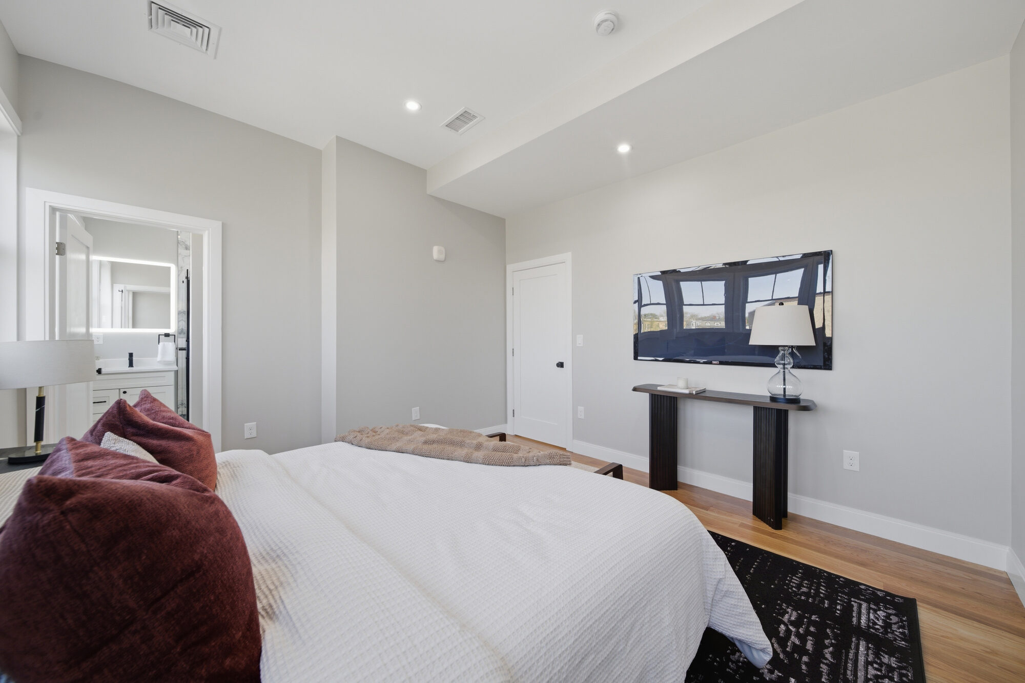 Primary bedroom looking toward the ensuite bathroom at 174 Walnut Street, Unit 3