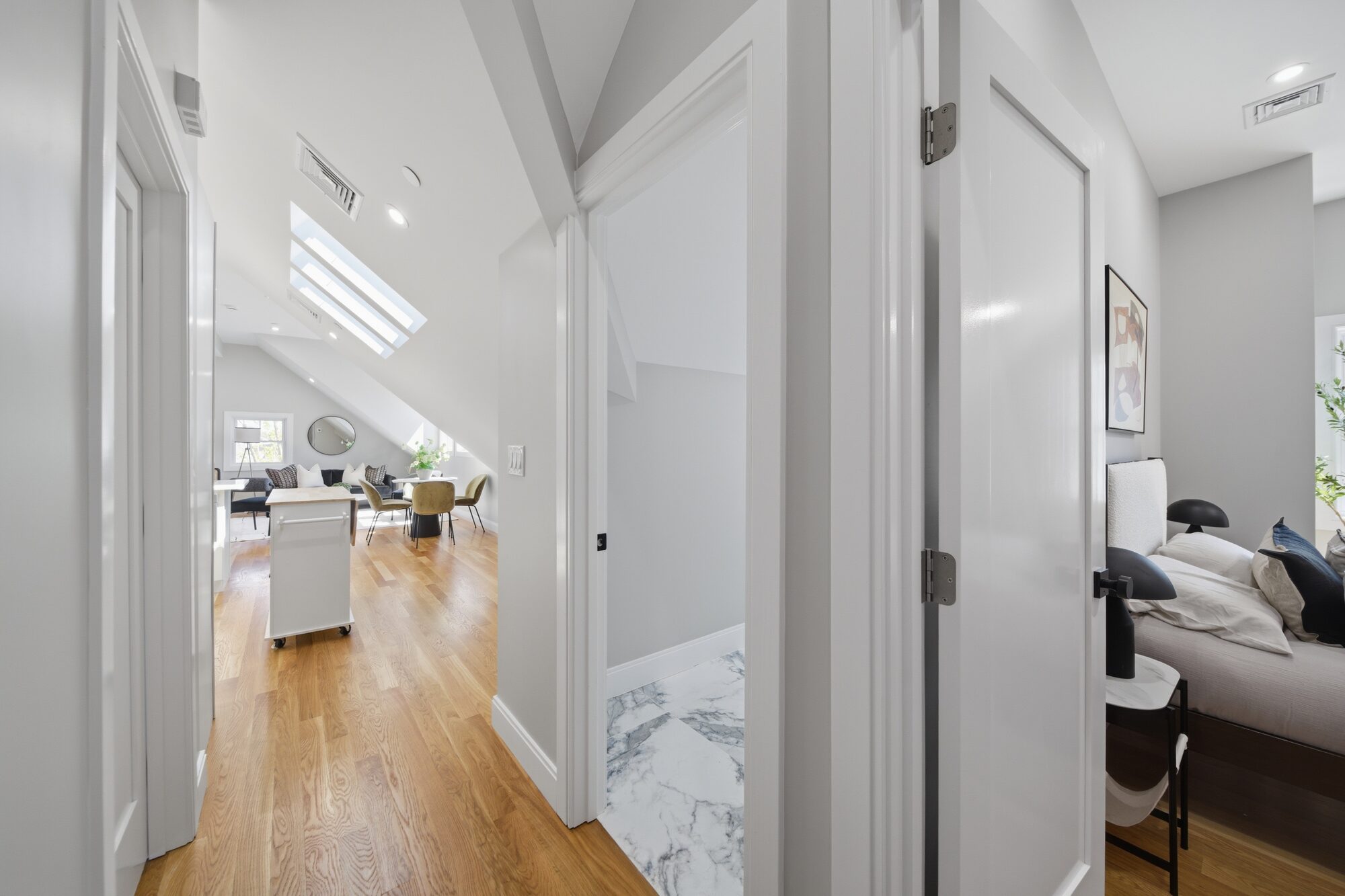 Hallway landing with skylights toward the living area at 174 Walnut Street, Unit 3