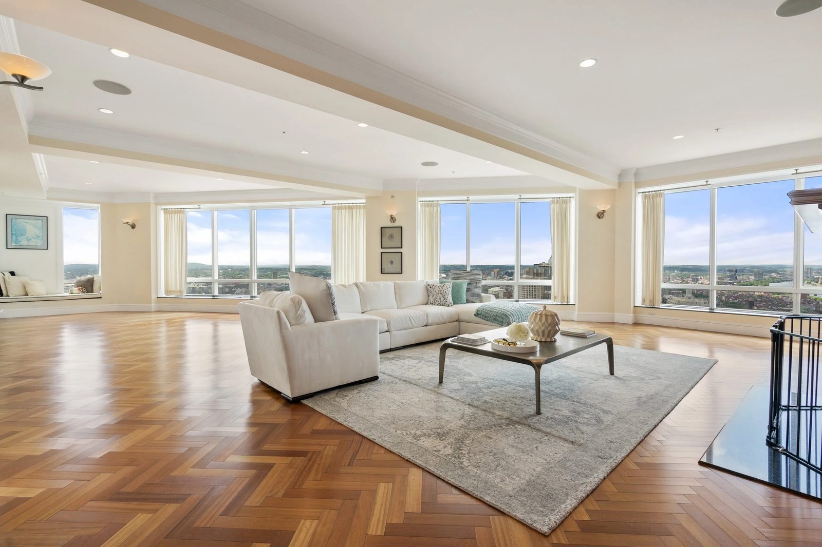 Luxury living room of the Ritz-Carlton Residences penthouse in downtown Boston with city skyline views