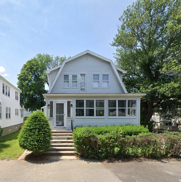 Front exterior of 86 Ballou Street, a four-bedroom colonial in Quincy sold December 2023